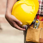 close-up-hard-hat-holding-by-construction-worker_329181-2825